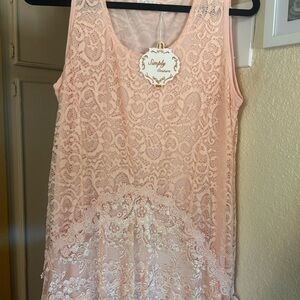 Pretty dress or tunic. Nice peach color